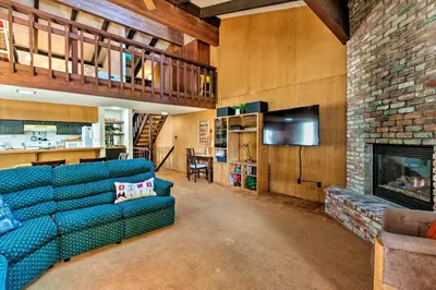 a living room with a couch and a fireplace at Ski Condo with Beach Access and 2 Mi to Diamond Peak! in Incline Village