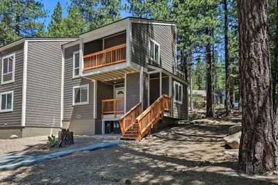 a large house with a deck in the woods at 1 Mi to Skiing and Beaches Incline Village Home! in Incline Village