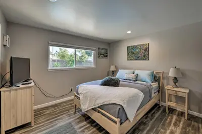 a bedroom with a bed and a television in it at Updated Sacramento Home with Grill, Patio, and Pool! in Sacramento