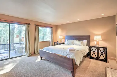 a bedroom with a large bed and a balcony at North Lake Tahoe Cabin 4 Mi to the Beach! in Tahoe Vista