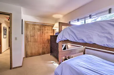 a bedroom with two bunk beds and a closet at North Lake Tahoe Cabin 4 Mi to the Beach! in Tahoe Vista