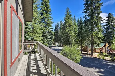a wooden balcony of a house with trees at North Lake Tahoe Cabin 4 Mi to the Beach! in Tahoe Vista