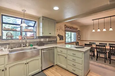 a kitchen with a sink and a dining room at North Lake Tahoe Cabin 4 Mi to the Beach! in Tahoe Vista