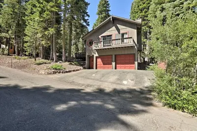 a house with a driveway with a garage at North Lake Tahoe Cabin 4 Mi to the Beach! in Tahoe Vista