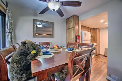 a stuffed bear sitting at a dining room table at Mammoth Lakes Condo, Walk to Shuttle and Village in Mammoth Lakes