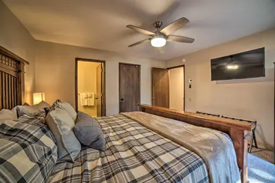 a bedroom with a bed with a ceiling fan at Mammoth Lakes Condo, Walk to Shuttle and Village in Mammoth Lakes