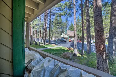 a view from the porch of a house with trees at Mammoth Lakes Condo, Walk to Shuttle and Village in Mammoth Lakes