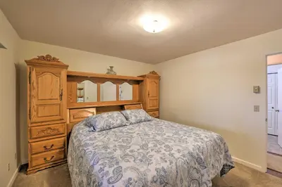 a bedroom with a bed and a wooden dresser at Cabin in Natl Forest 35 Min to Boreal Resort in Colfax