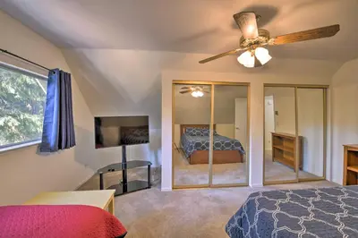 a bedroom with a bed and a ceiling fan at Cabin in Natl Forest 35 Min to Boreal Resort in Colfax