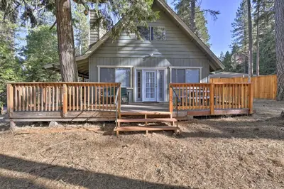 a house with two wooden decks in front of it at Cabin in Natl Forest 35 Min to Boreal Resort in Colfax