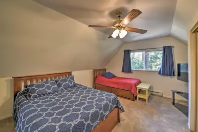 a bedroom with a bed and a ceiling fan at Cabin in Natl Forest 35 Min to Boreal Resort in Colfax