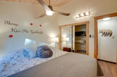 a bedroom with a bed with a blue pillow on it at 3 Mi to Heavenly Mountain Resort Home with Deck in Stateline