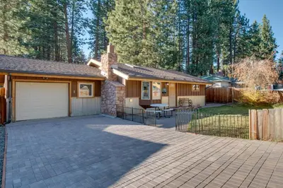 a house with a driveway and a garage at 3 Mi to Heavenly Mountain Resort Home with Deck in Stateline