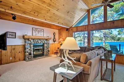 a living room with a couch and a fireplace at Hot Tub and Lake Tahoe Views Waterfront Retreat in Tahoma