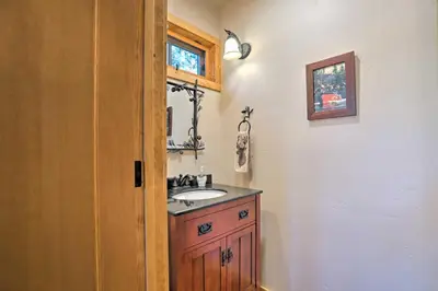 a bathroom with a sink and a mirror at Hot Tub and Lake Tahoe Views Kings Beach Lodge in Kings Beach