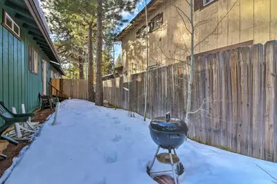 a grill sitting in the snow next to a fence at Home 1 Mi to Heavenly Mtn Resort! Unwind Fireside in South Lake Tahoe