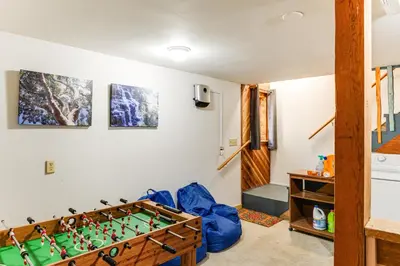 a room with a foosball table at Sequoia Forest Remote Retreat! Dreamtime Cabin in Ponderosa