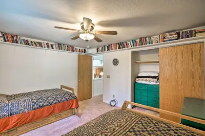 a bedroom with a bed and a ceiling fan at 4 Mi to Heavenly Home with Deck in South Lake Tahoe in South Lake Tahoe