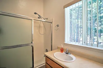 a bathroom with a shower and a sink at 4 Mi to Heavenly Home with Deck in South Lake Tahoe in South Lake Tahoe