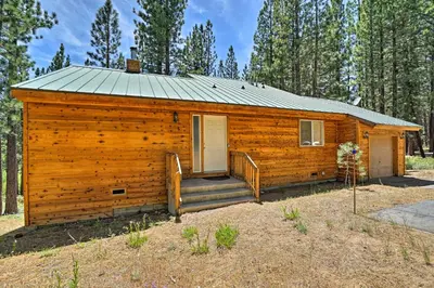 a log cabin with a porch and a door at 4 Mi to Heavenly Home with Deck in South Lake Tahoe in South Lake Tahoe