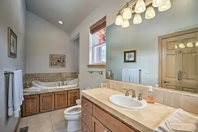 a bathroom with a sink and a toilet and a tub at 9 Mi to Heavenly Mountain South Lake Tahoe Home! in South Lake Tahoe