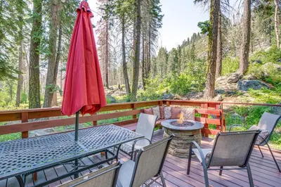 a patio with a table and chairs and a fire pit at Private Mountain Retreat 8 Mi to Lake Tahoe! in South Lake Tahoe