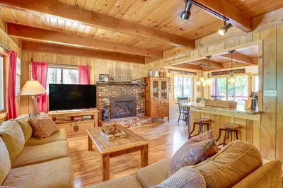 a living room with a couch and a fireplace at Private Mountain Retreat 8 Mi to Lake Tahoe! in South Lake Tahoe