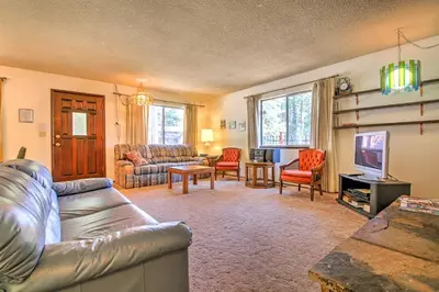a living room with a couch and a television at Hike, Bike and Ski South Lake Tahoe Retreat in South Lake Tahoe