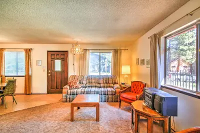 a living room with a couch and a tv at Hike, Bike and Ski South Lake Tahoe Retreat in South Lake Tahoe
