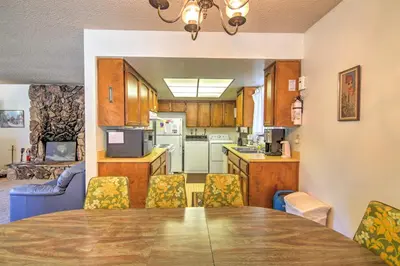 a kitchen and dining room with a table and chairs at Hike, Bike and Ski South Lake Tahoe Retreat in South Lake Tahoe