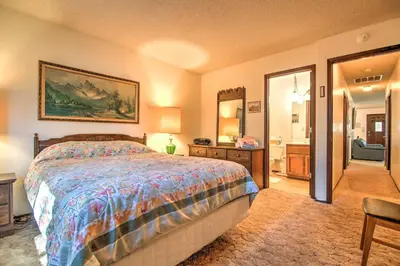 a bedroom with a bed and a mirror at Hike, Bike and Ski South Lake Tahoe Retreat in South Lake Tahoe