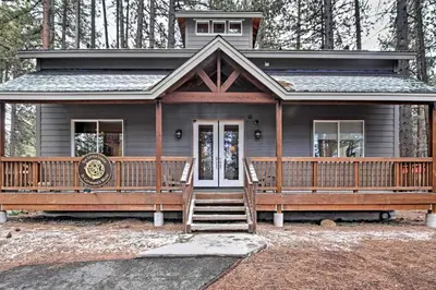 a house with a large front porch and stairs to it at 1 Mi to Mtn, 1 More to Shore! Luxury Tahoe Home in South Lake Tahoe