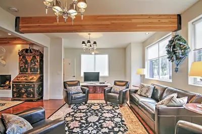 a living room with a couch and chairs and a table at 1 Mi to Mtn, 1 More to Shore! Luxury Tahoe Home in South Lake Tahoe