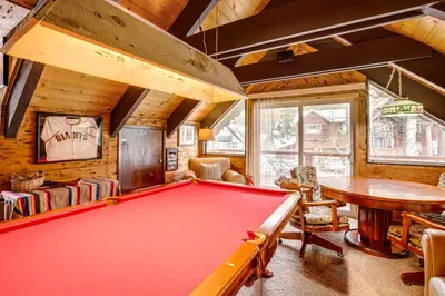 a billiard room with a pool table in a house at 11 Mi to Ski Resorts! Lake Tahoe Gem with Pool Table in South Lake Tahoe