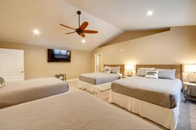 a bedroom with two beds and a ceiling fan at 4 Mi to Ski Mt Rose Sleek Reno-Lake Tahoe Home in Reno