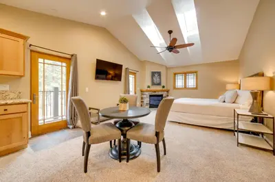 a bedroom with a bed and a table and chairs at 4 Mi to Ski Mt Rose Sleek Reno-Lake Tahoe Home in Reno