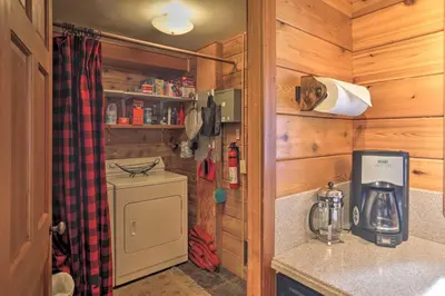 a kitchen in a wooden cabin with a counter top at 2 Mi to Northstar Resort Idyllic Cabin with Shuttle in Truckee