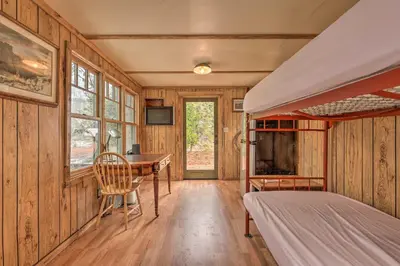 a bedroom with a desk and a bed in a room at Creekside Cabin 8 Mi to Kings Canyon National Park in Miramonte