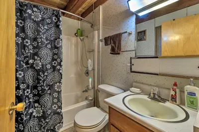a bathroom with a sink and a toilet and a shower at 6 Mi to Yosemite Natl Park 14-Acre Retreat! in Groveland