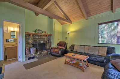 a living room with a couch and a fireplace at 6 Mi to Yosemite Natl Park 14-Acre Retreat! in Groveland