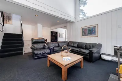a living room with a couch and a table at Chamonix # 62 in Mammoth Lakes