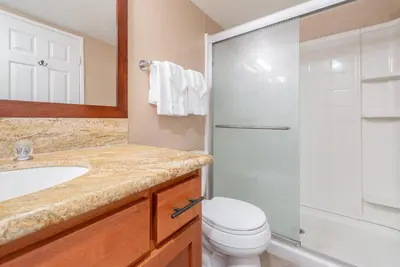 a bathroom with a sink and a toilet and a shower at Bigwood W #90 in Mammoth Lakes