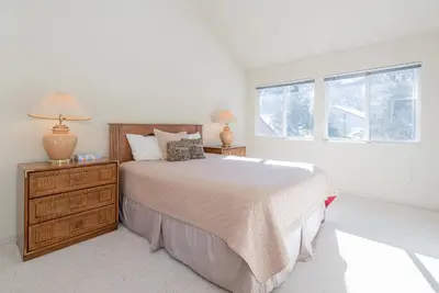 a white bedroom with a bed and a window at Snowcreek - #510 Phase IV in Mammoth Lakes