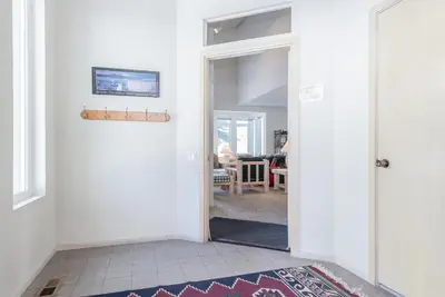 a hallway with a door open to a living room at Snowcreek - #510 Phase IV in Mammoth Lakes