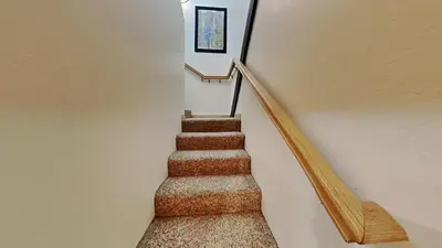 a stairway with a set of stairs leading up to a building at Spectacular 3 Bedroom Townhome with Pool in Mammoth Lakes