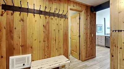 a room with wood paneled walls and a door at Spectacular 3 Bedroom Townhome with Pool in Mammoth Lakes