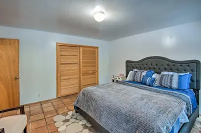 a bedroom with a bed and a wooden closet at 7 Mi to Heavenly Ski Resort Cozy Tahoe Cabin in South Lake Tahoe