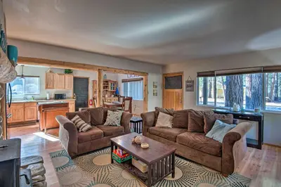 a living room with two couches and a table at 7 Mi to Heavenly Ski Resort Cozy Tahoe Cabin in South Lake Tahoe