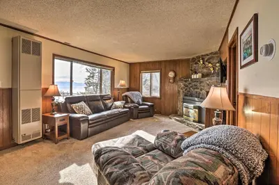 a living room with a couch and a fireplace at Lakefront Cabin with Beach Access 8 Mi to Northstar in Tahoe Vista