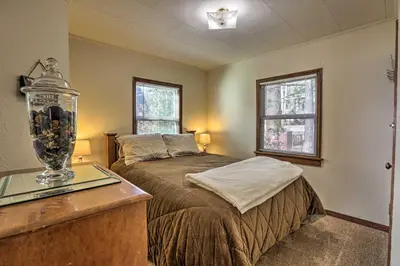 a bedroom with a bed and a fish tank on a desk at Lakefront Cabin with Beach Access 8 Mi to Northstar in Tahoe Vista